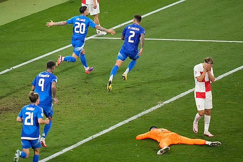 Mattia Zaccagni celebrates after scoring a goal for Italy